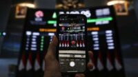 Lihat saham asing yang diminati sepekan, IHSG turun ke 7.097